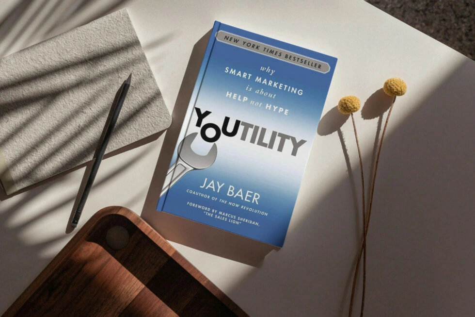 A copy of the book "youtility" by jay baer, a new york times bestseller on smart marketing
